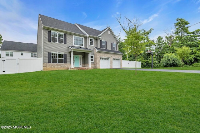 10 Willow Ave, Matawan, NJ 07747 - view of front facade featuring driveway, a garage, and stone siding