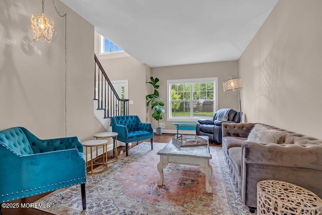 10 Willow Ave, Matawan, NJ 07747 - living area with healthy amount of natural light, stairway, wood finished floors, and a chandelier