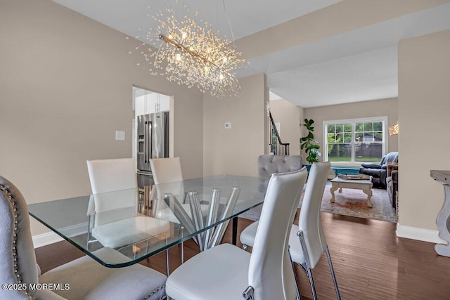 10 Willow Ave, Matawan, NJ 07747 - dining space with stairs, dark wood-type flooring, and a chandelier