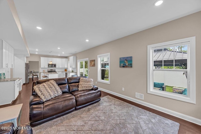 10 Willow Ave, Matawan, NJ 07747 - living room with plenty of natural light, dark wood-style flooring, and recessed lighting