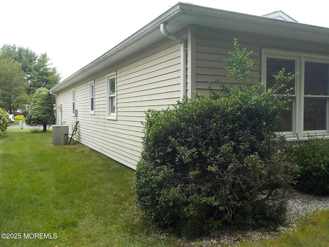 17 Meadowbrook Rd, Brick, NJ 08723 - view of side of property with a central AC unit and a yard