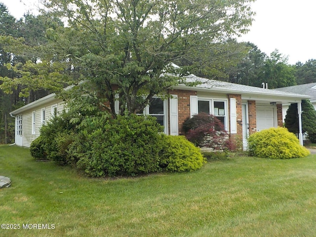 17 Meadowbrook Rd, Brick, NJ 08723 - view of front facade featuring a garage, a front yard, and brick siding
