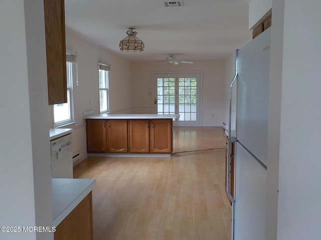17 Meadowbrook Rd, Brick, NJ 08723 - kitchen featuring white appliances, brown cabinets, a ceiling fan, light wood-style flooring, and light countertops