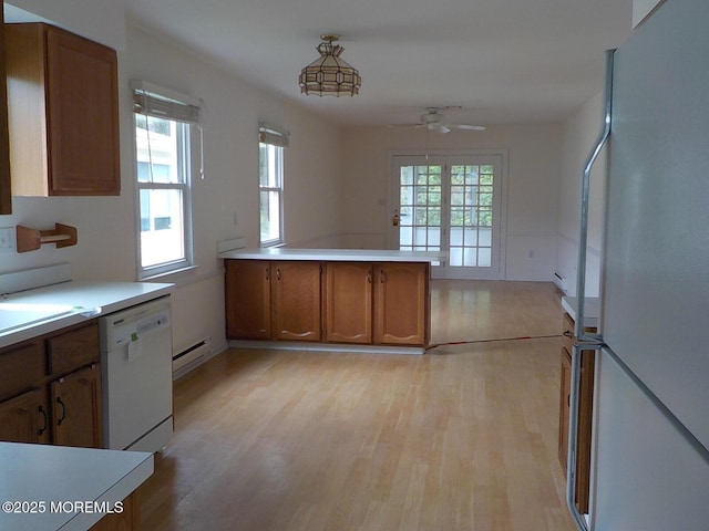 17 Meadowbrook Rd, Brick, NJ 08723 - kitchen featuring white appliances, brown cabinetry, light wood-style flooring, a ceiling fan, and light countertops