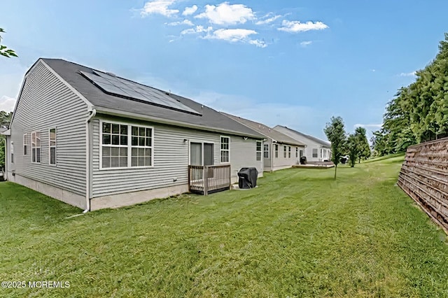 114 Maypink Ln, Howell, NJ 07731 - back of property with roof mounted solar panels and a yard