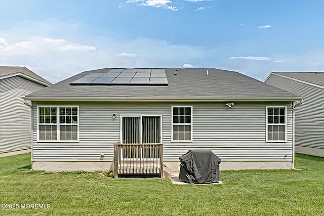 114 Maypink Ln, Howell, NJ 07731 - rear view of property with solar panels and a lawn