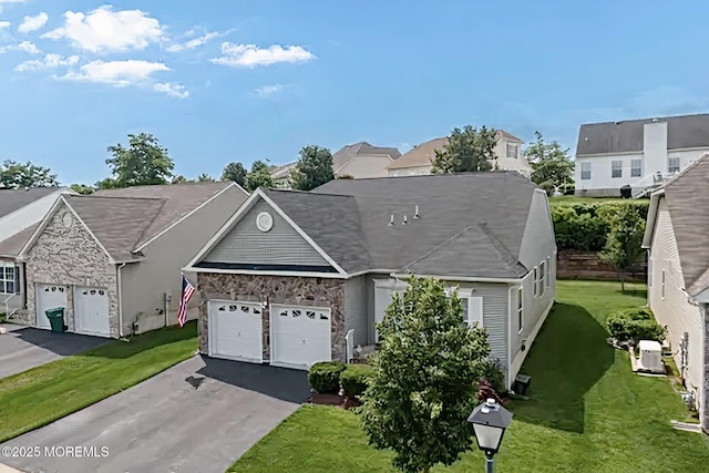 114 Maypink Ln, Howell, NJ 07731 - view of front facade featuring stone siding, a garage, asphalt driveway, a residential view, and a front lawn