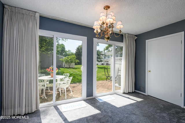 60 Beaumont Ct, Tinton Falls, NJ 07724 - doorway with a textured ceiling, a chandelier, and carpet flooring