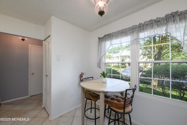 60 Beaumont Ct, Tinton Falls, NJ 07724 - dining area with light tile patterned floors and a textured ceiling