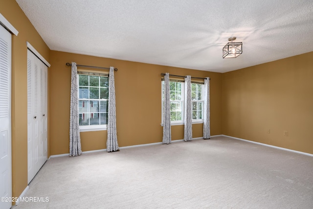 60 Beaumont Ct, Tinton Falls, NJ 07724 - spare room featuring carpet, plenty of natural light, and a textured ceiling
