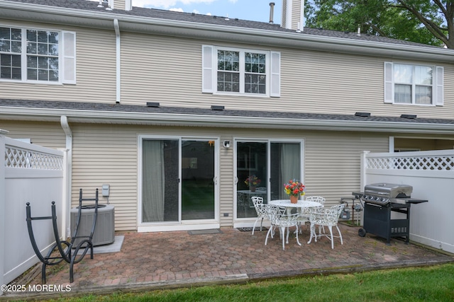 60 Beaumont Ct, Tinton Falls, NJ 07724 - back of property with a patio and a chimney