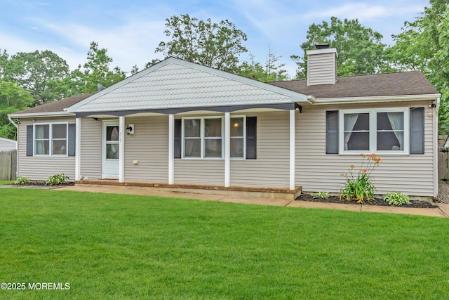 217 Hemlock Dr, Lanoka Harbor, NJ 08734 - view of front of house with a front yard and a chimney