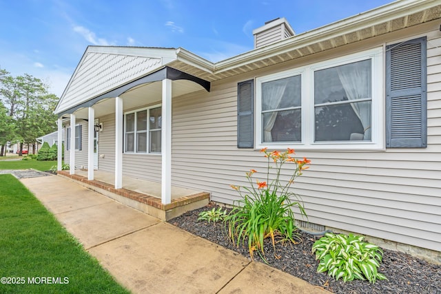 217 Hemlock Dr, Lanoka Harbor, NJ 08734 - view of property exterior featuring a porch and a chimney