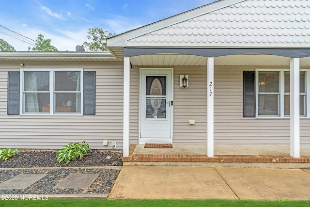 217 Hemlock Dr, Lanoka Harbor, NJ 08734 - view of exterior entry with a porch