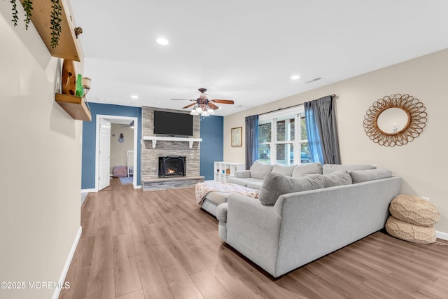 217 Hemlock Dr, Lanoka Harbor, NJ 08734 - living room with a ceiling fan, light wood finished floors, a stone fireplace, and recessed lighting
