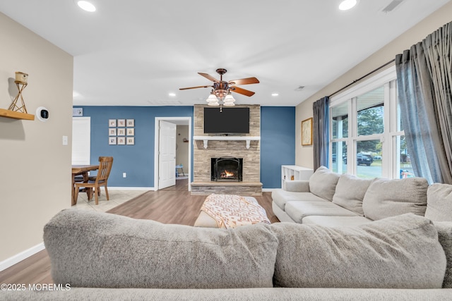 217 Hemlock Dr, Lanoka Harbor, NJ 08734 - living room with recessed lighting, wood finished floors, a ceiling fan, and a stone fireplace