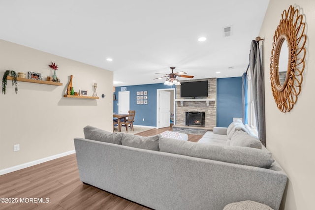 217 Hemlock Dr, Lanoka Harbor, NJ 08734 - living room with wood finished floors, a ceiling fan, a stone fireplace, and recessed lighting