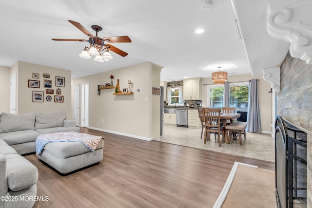 217 Hemlock Dr, Lanoka Harbor, NJ 08734 - living room featuring ceiling fan, light wood-style flooring, a glass covered fireplace, and recessed lighting