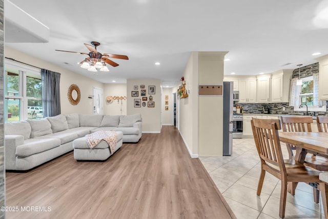 217 Hemlock Dr, Lanoka Harbor, NJ 08734 - living room featuring ceiling fan, healthy amount of natural light, recessed lighting, and light wood-type flooring