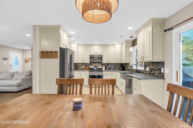 217 Hemlock Dr, Lanoka Harbor, NJ 08734 - kitchen featuring appliances with stainless steel finishes, decorative backsplash, a chandelier, open floor plan, and recessed lighting