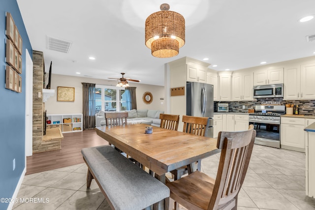 217 Hemlock Dr, Lanoka Harbor, NJ 08734 - dining space featuring light tile patterned floors, ceiling fan, and recessed lighting