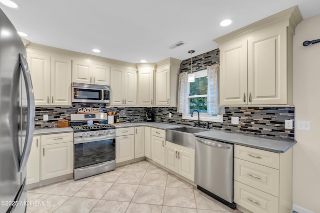 217 Hemlock Dr, Lanoka Harbor, NJ 08734 - kitchen featuring stainless steel appliances, cream cabinets, tasteful backsplash, hanging light fixtures, and recessed lighting
