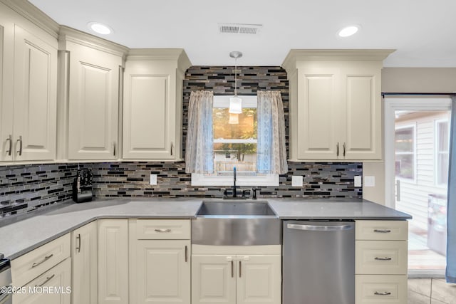 217 Hemlock Dr, Lanoka Harbor, NJ 08734 - kitchen with stainless steel dishwasher, plenty of natural light, and tasteful backsplash