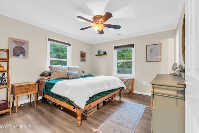 217 Hemlock Dr, Lanoka Harbor, NJ 08734 - bedroom with crown molding, light wood-style floors, and a ceiling fan