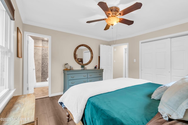 217 Hemlock Dr, Lanoka Harbor, NJ 08734 - bedroom featuring a closet, wood finished floors, ceiling fan, connected bathroom, and ornamental molding