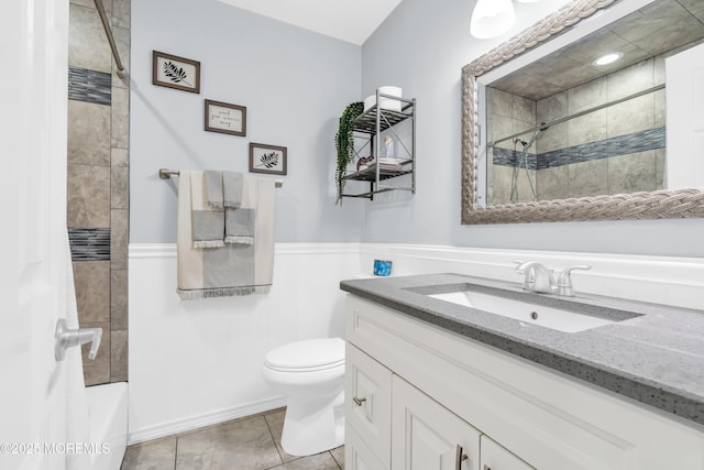 217 Hemlock Dr, Lanoka Harbor, NJ 08734 - full bath with vanity, a wainscoted wall, tiled shower / bath combo, and tile patterned flooring