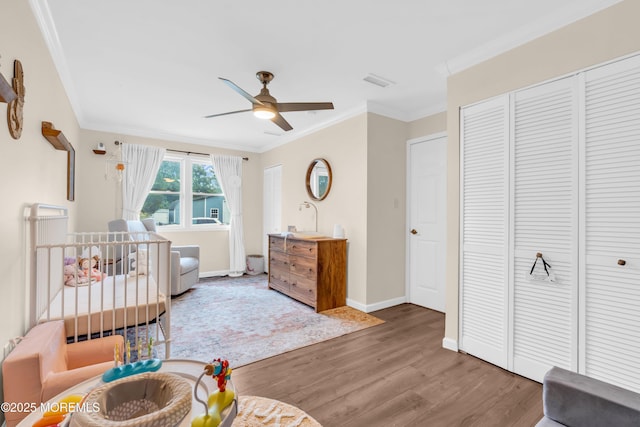 217 Hemlock Dr, Lanoka Harbor, NJ 08734 - bedroom featuring crown molding, wood finished floors, and ceiling fan