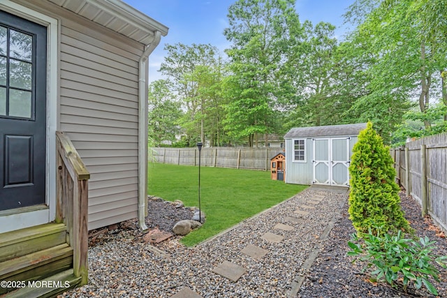 217 Hemlock Dr, Lanoka Harbor, NJ 08734 - fenced backyard featuring entry steps and a storage unit