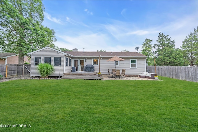 217 Hemlock Dr, Lanoka Harbor, NJ 08734 - back of property featuring a fenced backyard, a deck, a chimney, and an outdoor hangout area