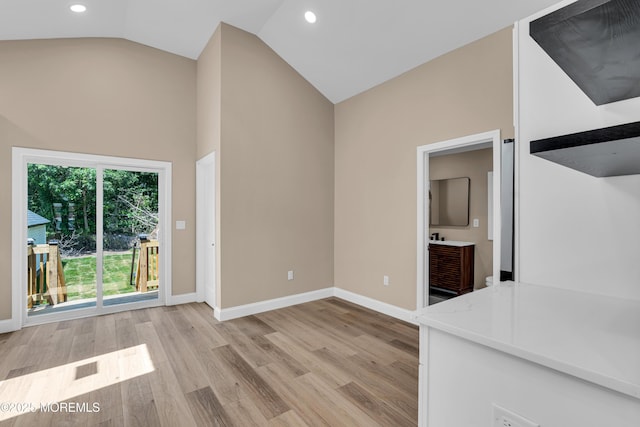 21 Harrison Ave, Englishtown, NJ 07726 - unfurnished living room with high vaulted ceiling, light wood-style flooring, and recessed lighting