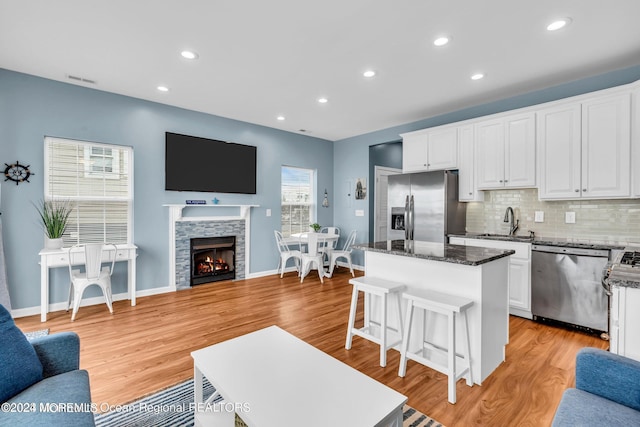 681/2 Shrewsbury Ave, Highlands, NJ 07732 - kitchen with stainless steel appliances, open floor plan, a center island, white cabinetry, and recessed lighting