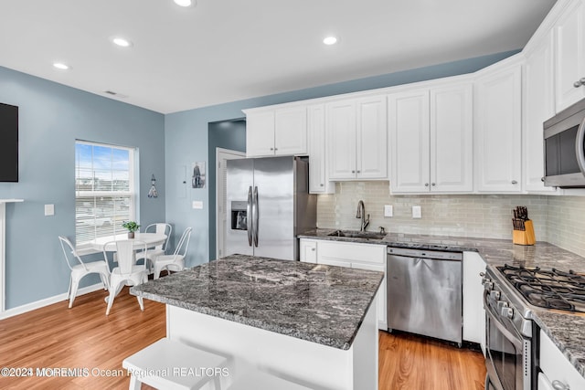 681/2 Shrewsbury Ave, Highlands, NJ 07732 - kitchen featuring appliances with stainless steel finishes, light wood-style floors, white cabinets, and recessed lighting