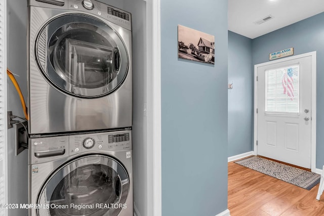 681/2 Shrewsbury Ave, Highlands, NJ 07732 - laundry area featuring stacked washer / drying machine and wood finished floors