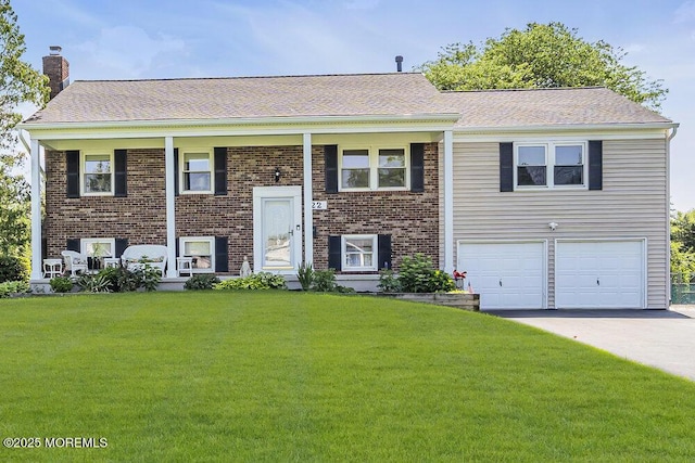 22 Indian Hill Rd, Freehold, NJ 07728 - split foyer home with a chimney, a front lawn, an attached garage, and driveway