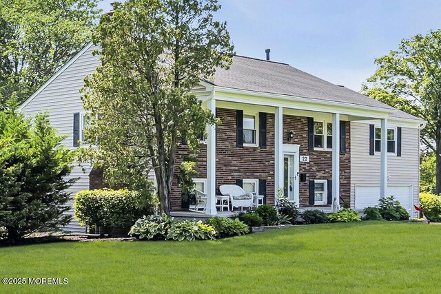 22 Indian Hill Rd, Freehold, NJ 07728 - raised ranch with a front yard, a porch, and an attached garage