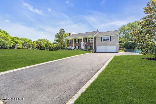 22 Indian Hill Rd, Freehold, NJ 07728 - raised ranch with a garage, driveway, a chimney, and a front lawn