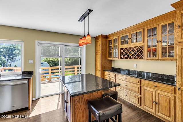 22 Indian Hill Rd, Freehold, NJ 07728 - kitchen with dishwasher, brown cabinets, a kitchen island, dark wood-style flooring, and a breakfast bar