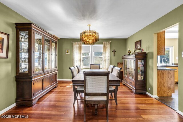 22 Indian Hill Rd, Freehold, NJ 07728 - dining area featuring a chandelier and dark wood-type flooring