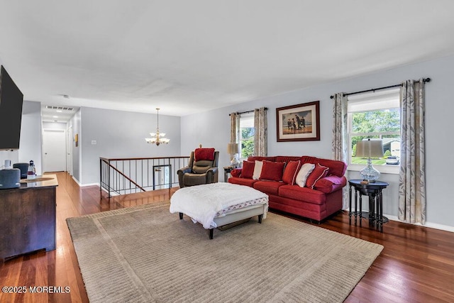 22 Indian Hill Rd, Freehold, NJ 07728 - living room with a chandelier, wood finished floors, and healthy amount of natural light