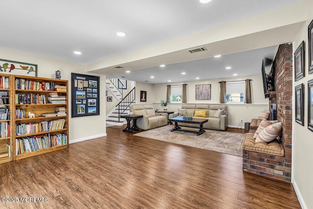 22 Indian Hill Rd, Freehold, NJ 07728 - living area with wood finished floors, stairway, recessed lighting, and a fireplace