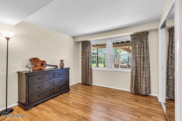 22 Indian Hill Rd, Freehold, NJ 07728 - bedroom with light wood-style floors and baseboards