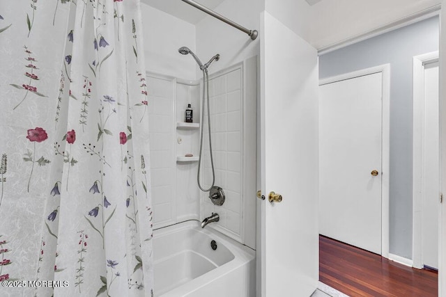 22 Indian Hill Rd, Freehold, NJ 07728 - bathroom featuring shower / tub combo with curtain and wood finished floors