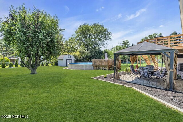 22 Indian Hill Rd, Freehold, NJ 07728 - view of grassy yard with a gazebo, a shed, an outdoor pool, and a patio area