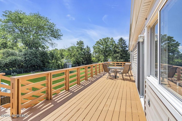 22 Indian Hill Rd, Freehold, NJ 07728 - wooden terrace with view of wooded area and outdoor dining area