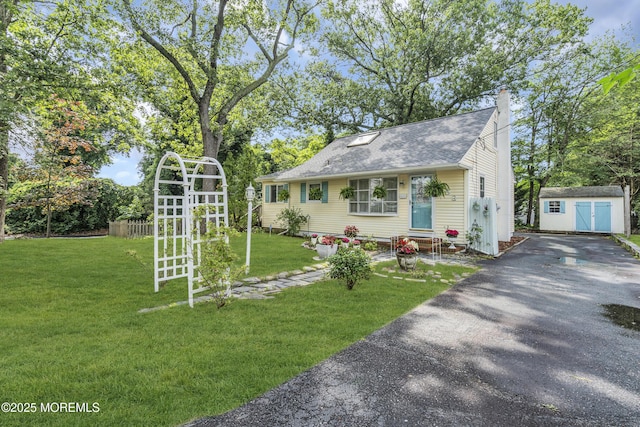 553 Kingfisher Cir, Brick, NJ 08723 - view of front of home with driveway, a storage unit, a chimney, and roof with shingles