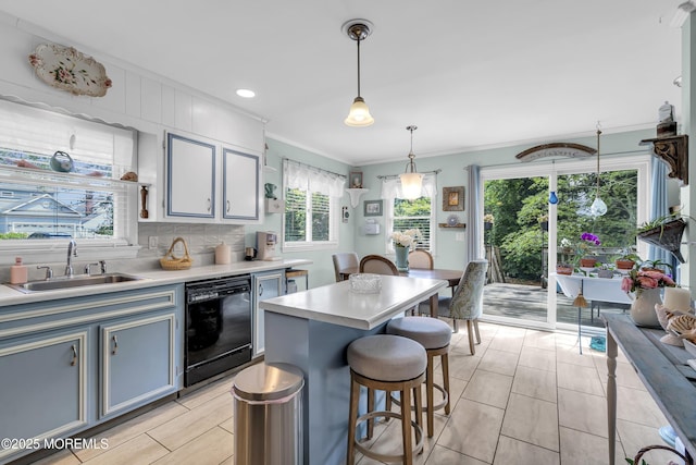 553 Kingfisher Cir, Brick, NJ 08723 - kitchen featuring dishwasher, crown molding, light countertops, a breakfast bar area, and pendant lighting